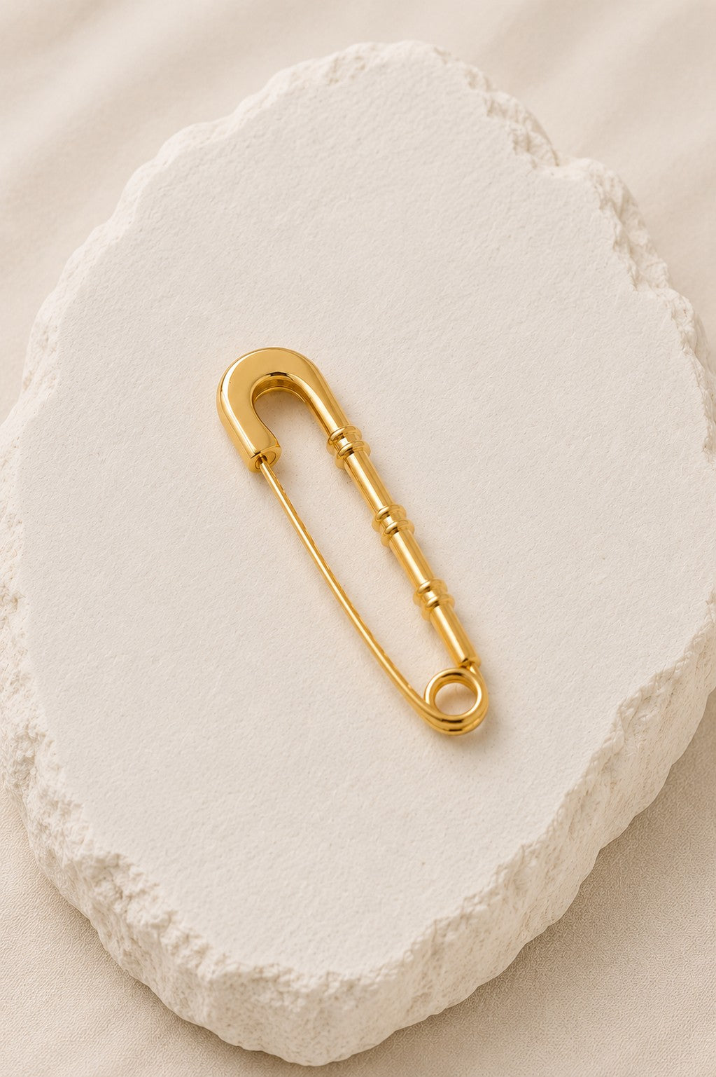 Alfinete dourado
